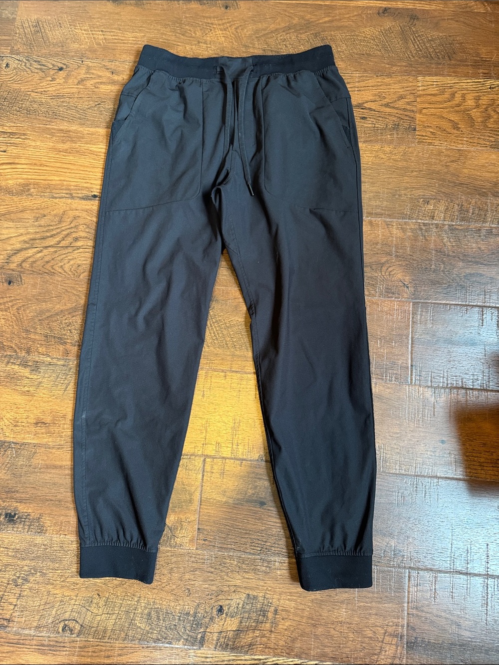 Like new mens size Large Lululemon joggers in deep black color.